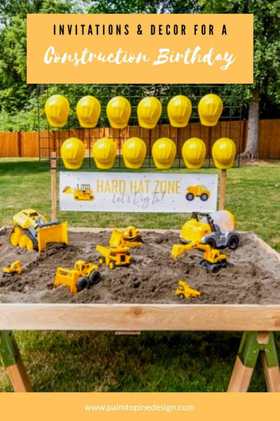 construction birthday party sandbox with hard hats and custom hard hat zone banner