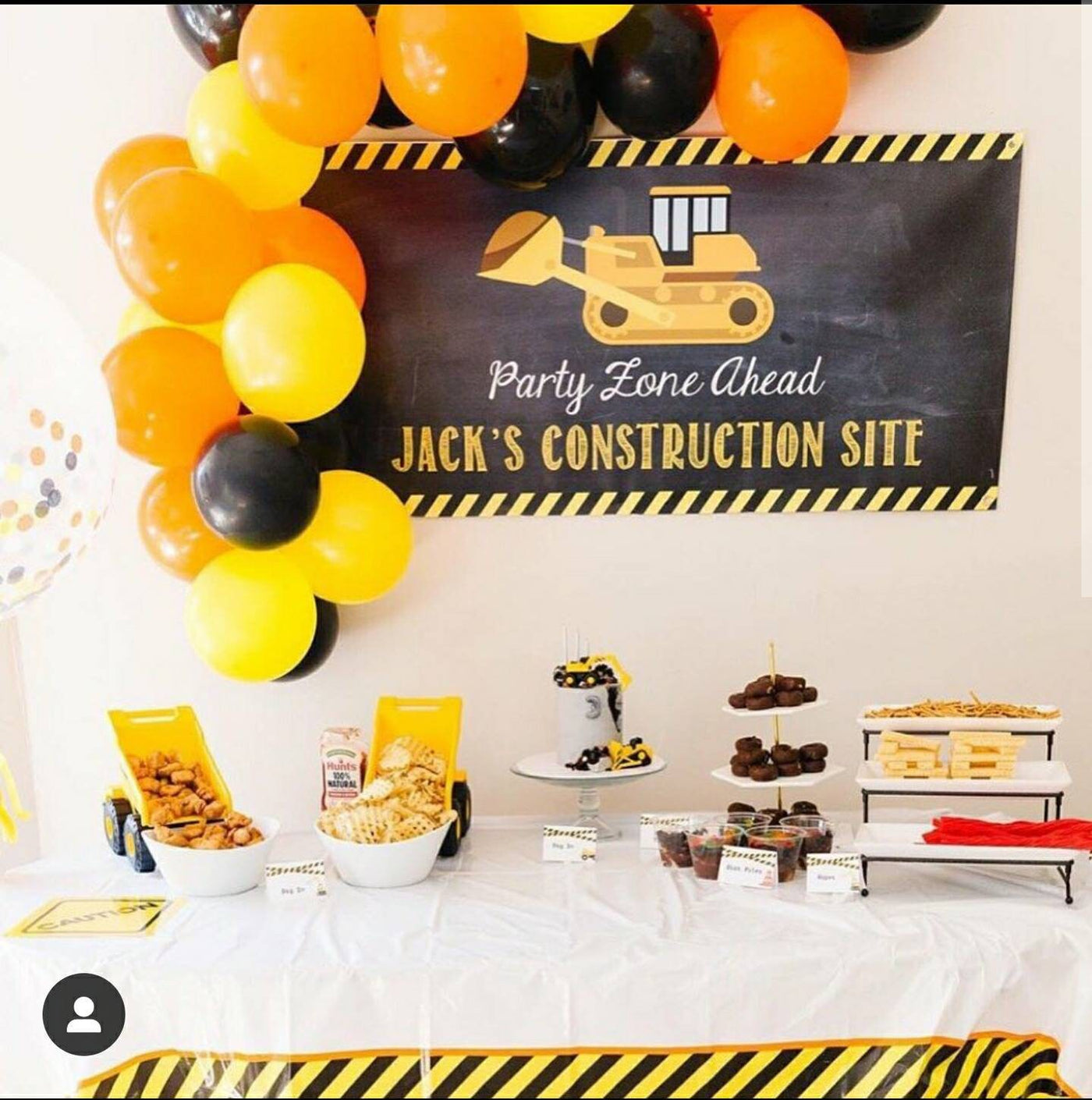 Boys Construction birthday party with personalized banner, balloon garland and construction themed birthday treats