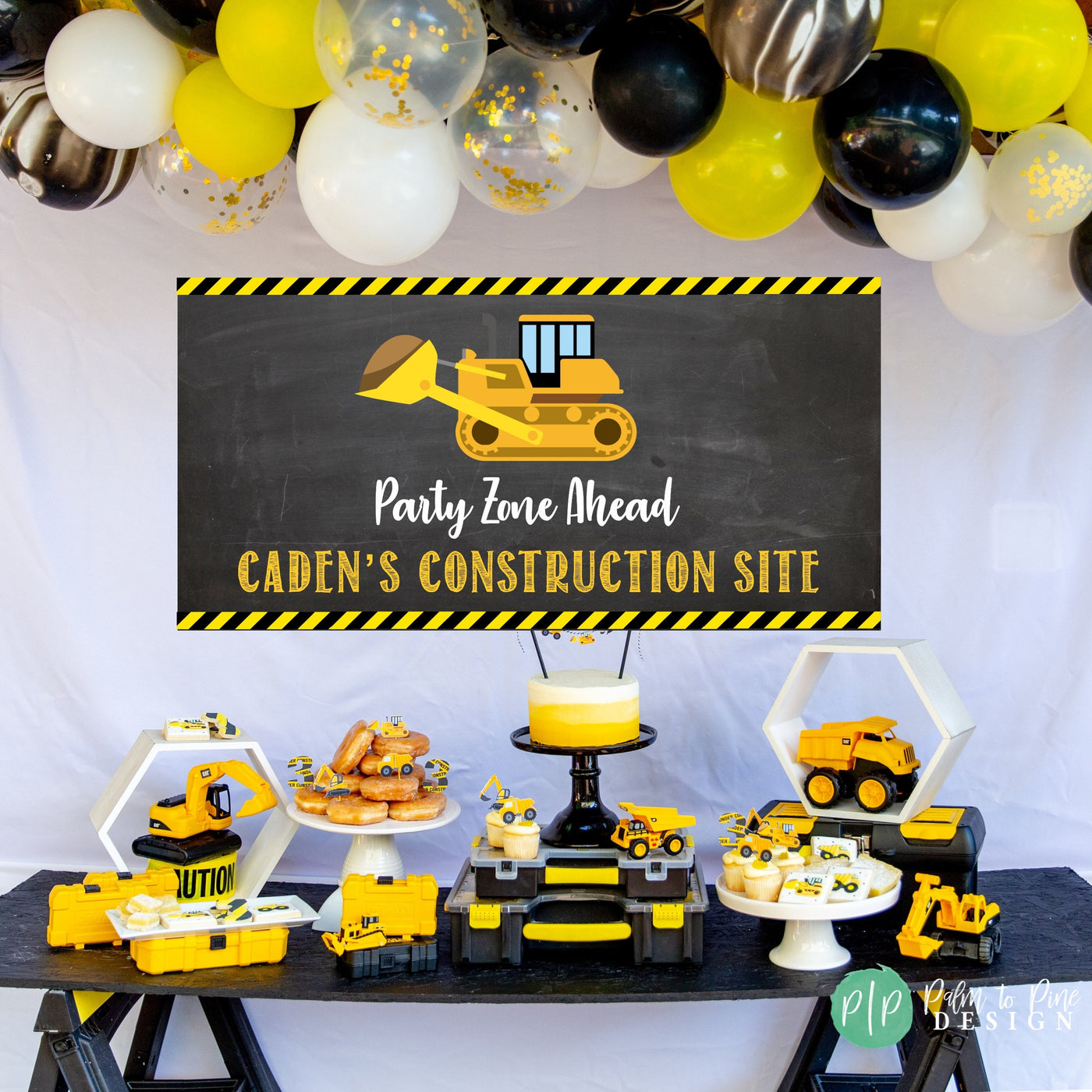 boys construction birthday party with custom construction site banner and construction equipment themed desserts with tool boxes and toy construction vehicles