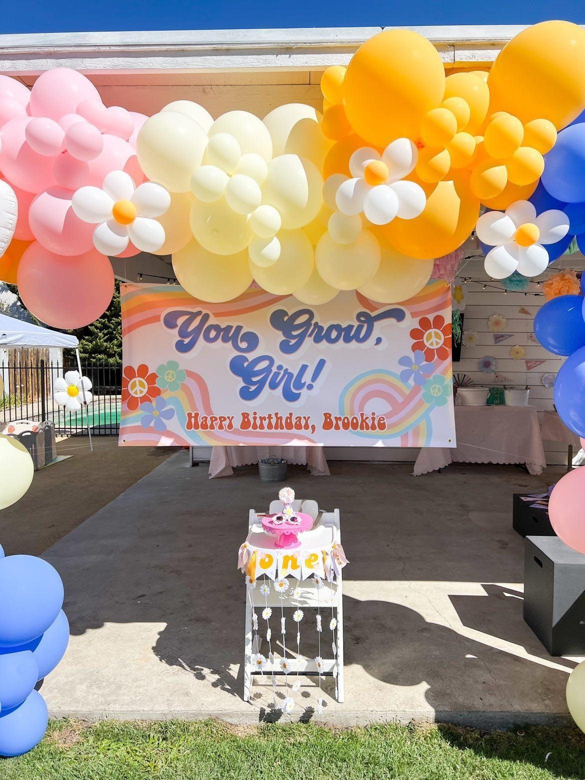 Groovy Birthday Banner Party with personalized banner and balloon garland