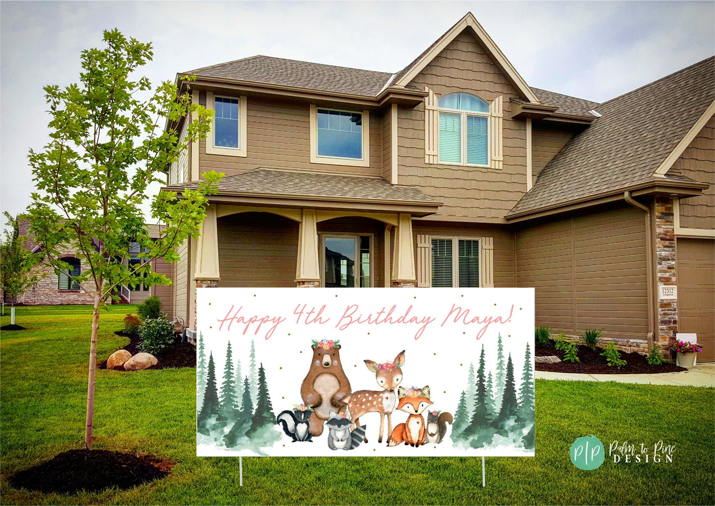 A white yard sign with a pink and green woodland theme. The sign reads &#39;Happy Birthday&#39; and features a bear, deer, fox, with floral crowns and other woodland creatures in a forest setting.