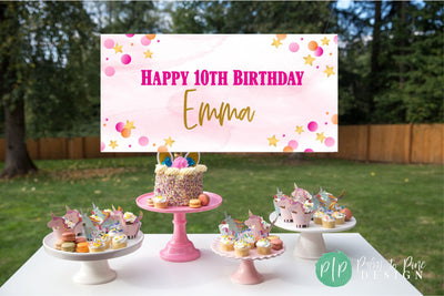 girls birthday banner for 10th birthday with pink and gold stars and polka dots in front of a simplistic dessert table