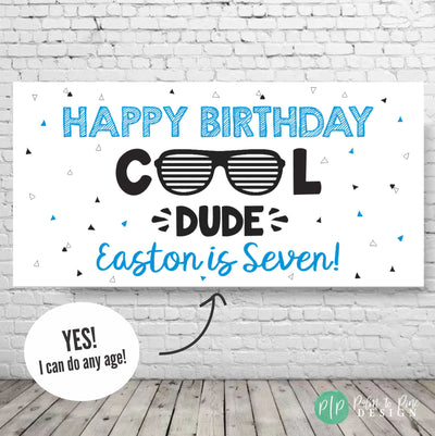 Cool Dude Birthday Banner with black and blue triangles and aviator sunglasses for kids birthday party