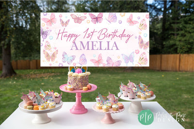 A charming pink and purple butterfly birthday banner, decorated with delicate butterfly graphics and soft pastel hues for a magical party look.