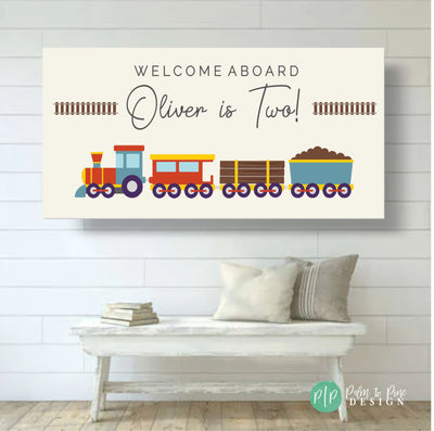 A minimalist train birthday banner with a modern design on a light tan background, featuring red, yellow, and blue train clipart with railroad tracks