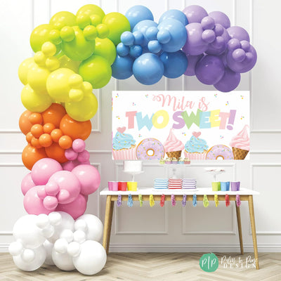 Dessert-themed &quot;Two Sweet&quot; birthday banner with rainbow colors, featuring cupcakes, donuts, sprinkles and ice cream cones for a second birthday party.