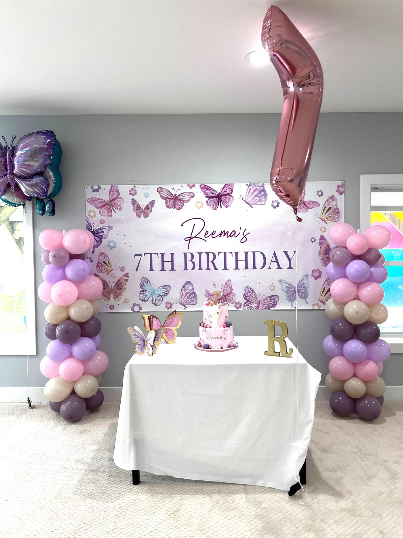 Butterfly birthday party for girl with pinks, purples and tan