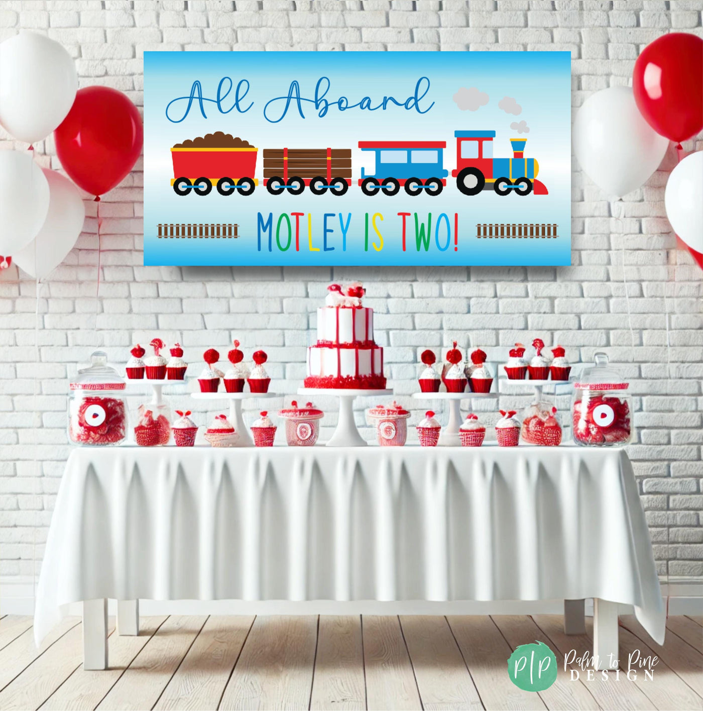 train birthday party with personalized banner and red and white dessert table