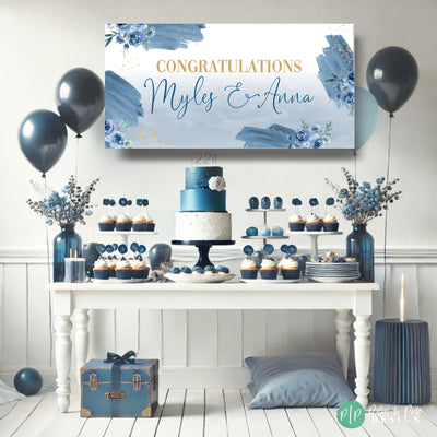 Personalized dusty blue rose party banner with romantic floral designs in front of a navy and white dessert table