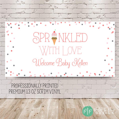 Ice cream-themed baby shower sprinkle banner featuring pink sprinkles and welcome baby wording